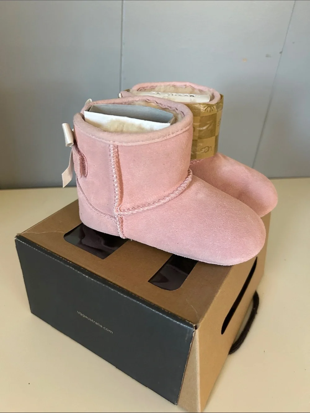 UGG Kids Pink Suede Booties with Bow Detail